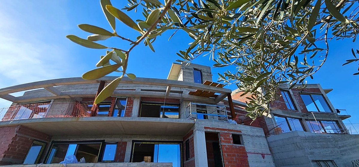 Akra Vista villa under construction — the shell, among the olive groves